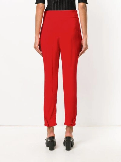 Shop Givenchy Tapered Trousers In Red