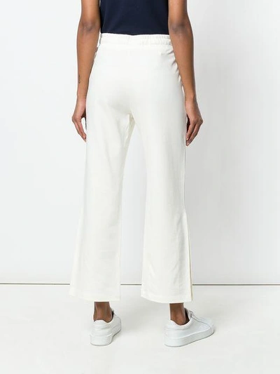 Shop Moncler Cropped Track Pants In White