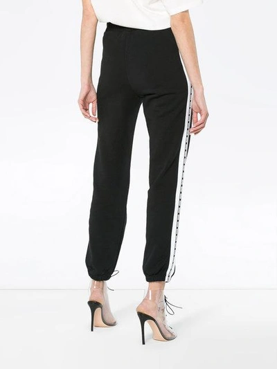 Shop Msgm Brand Stripe Track Trousers In Black