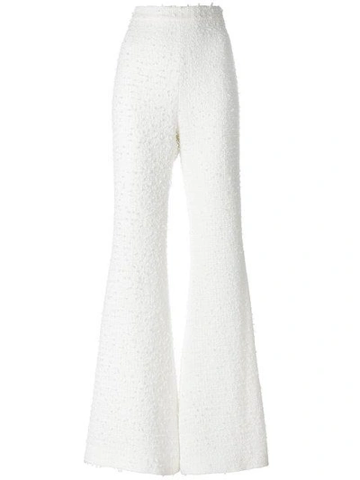 Shop Balmain Bouclé Tweed Flared Trousers In White