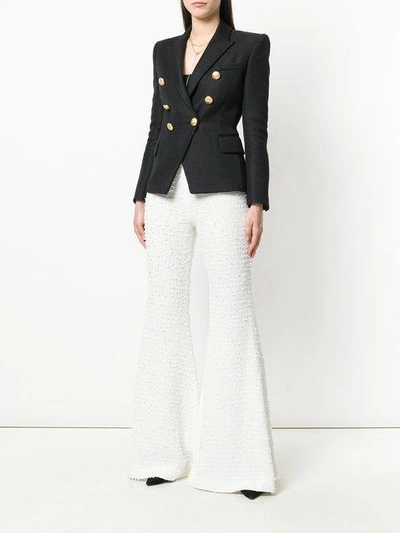 Shop Balmain Bouclé Tweed Flared Trousers In White