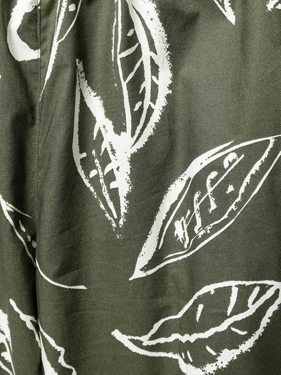 Shop Aspesi Leaf Print Trousers