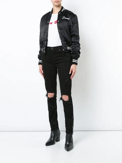 Shop Amiri Thrasher Skinny Jeans In Black
