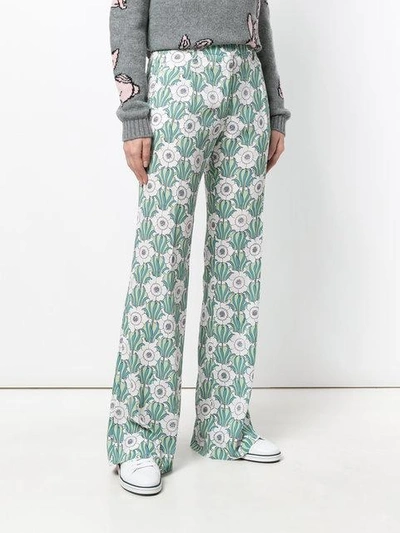 Shop Prada Floral Print Flared Trousers In Green