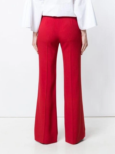 Shop Chloé High-rise Flared Trousers In Red