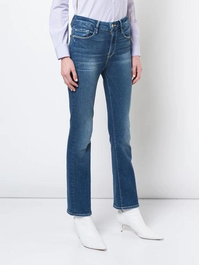 Shop Frame Cropped Flared Jeans In Blue