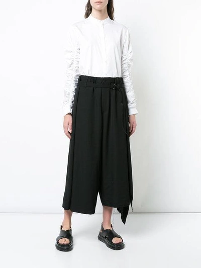 Shop Yohji Yamamoto Asymmetric Cropped Palazzo Trousers - Black
