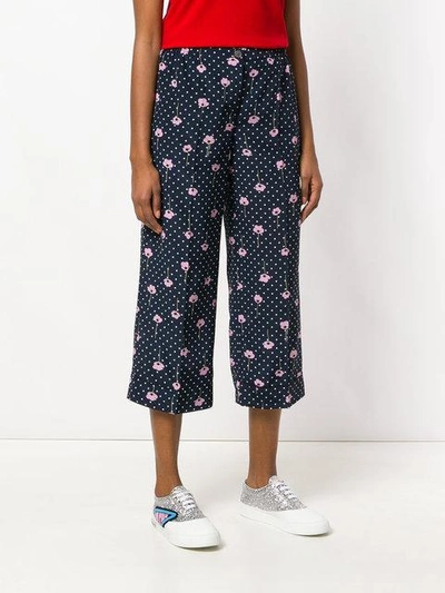 Shop Miu Miu Flower Print Trousers In Blue