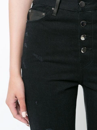Shop Amiri Cropped Flared Jeans In Black