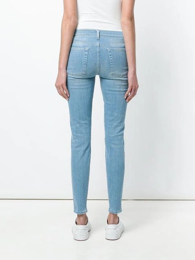 Shop 7 For All Mankind Distressed Skinny Jeans - Blue