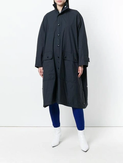 Shop Balenciaga Logo-print Raincoat In Black