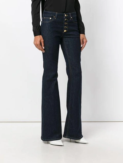 Shop Michael Michael Kors Flared Jeans In Blue