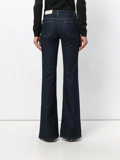 Shop Michael Michael Kors Flared Jeans In Blue
