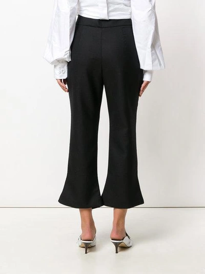 Shop Jacquemus Slit Hem Cropped Pants In Black