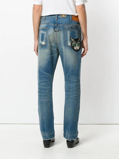 Shop Gucci Mystic Cat Print Jeans In Blue