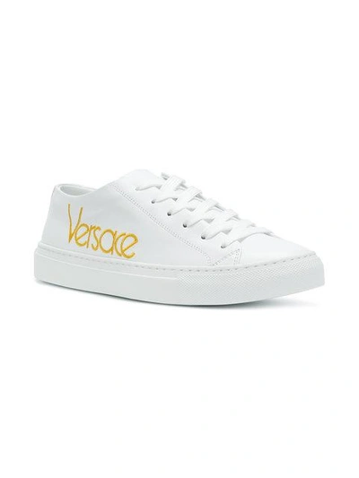 Shop Versace Embroidered Logo Sneakers In White