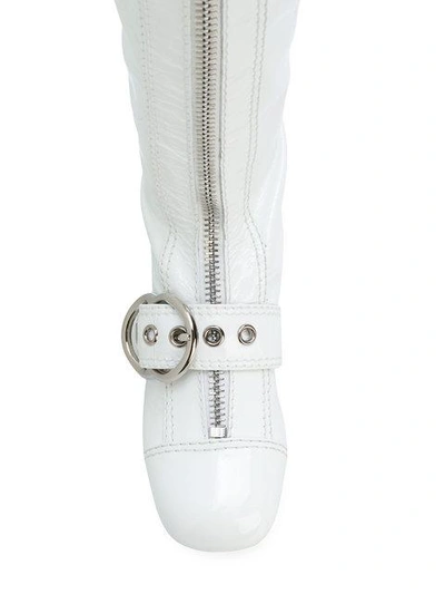 Shop Miu Miu Buckle Strap Boots In White
