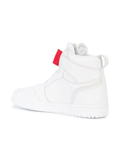 Shop Nike Jordan 1 High Zip Sneakers - White