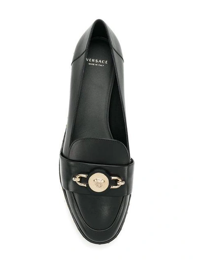 Shop Versace Medusa Studded Loafers - Black