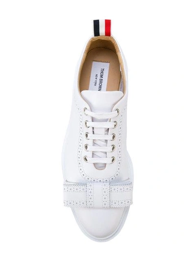Shop Thom Browne Brogued Trainer With Bow & Lightweight Rubber Sole In Calf Leather