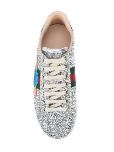 Shop Gucci New Ace Saturn Sneakers - Metallic