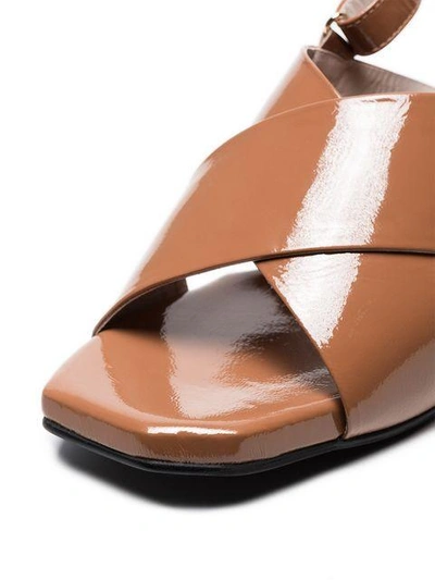 Shop Reike Nen Brown 60 Patent Leather Cross-over Sandals