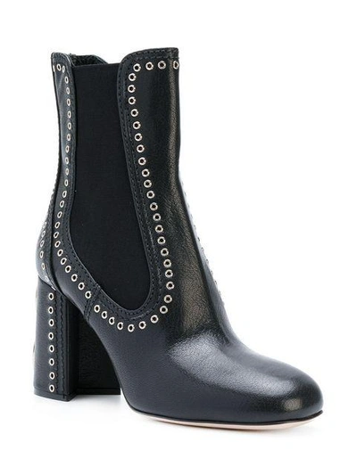 Shop Miu Miu Studded Boots - Black