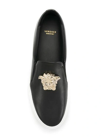 Shop Versace Palazzo Slip-on Sneakers - Black