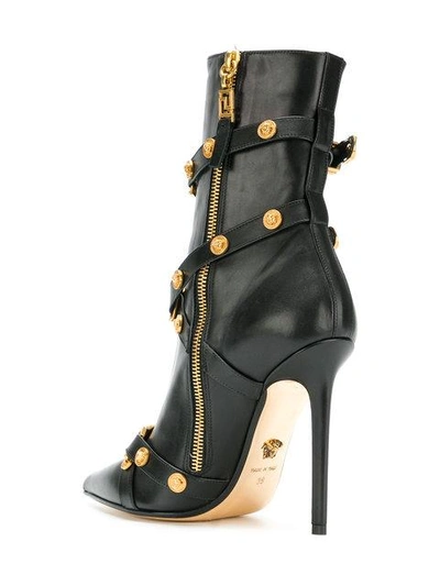 Shop Versace Buckled Ankle Boots