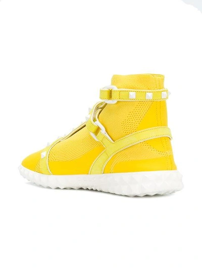 Shop Valentino Free Rockstud Bodytech Sneakers In Yellow