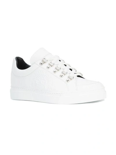 Shop Balmain Embossed Low-top Sneakers In White