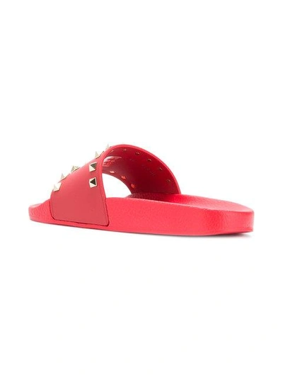 Shop Valentino Garavani Rockstud Slide Sandals In Red