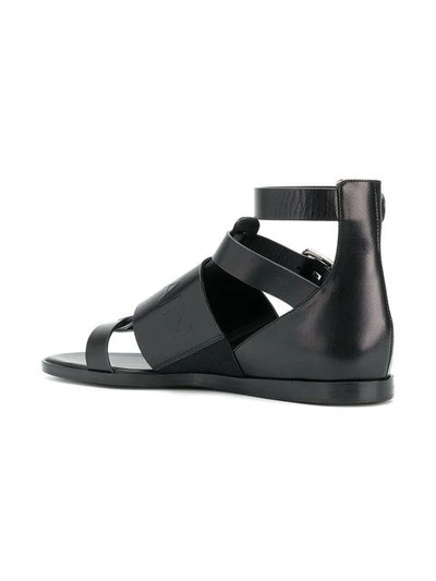 Shop Balmain Logo Embossed Sandals In Black