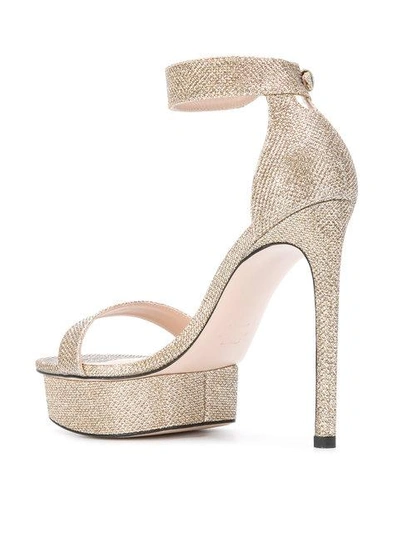 Shop Stuart Weitzman Back Up Sandals - Metallic