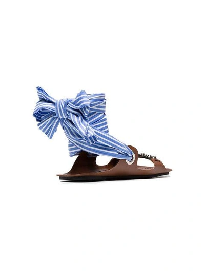 Shop Prada Brown Gladiator Sandals With Studs And Black Ribbon And A Blue And White Striped Ribbon