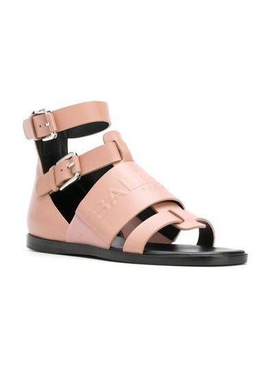 Shop Balmain Embossed Logo Roman Sandals - Nude & Neutrals