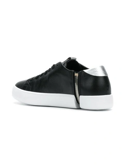 Shop Diesel Side Zip Sneakers In Black
