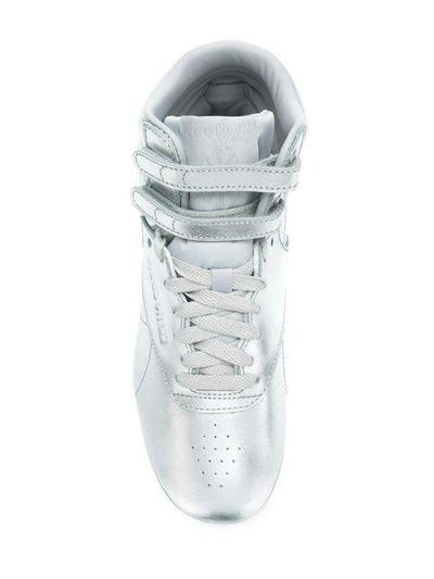 Shop Reebok Freestyle Sneakers - Metallic