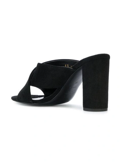 Shop Saint Laurent Cross Over Strap Mules In 1000 Black