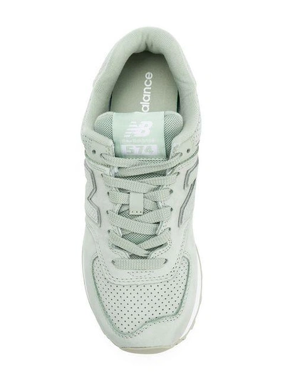 Shop New Balance 574 Sneakers - Green