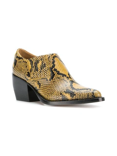 Shop Chloé Snake Printed Boots In Yellow