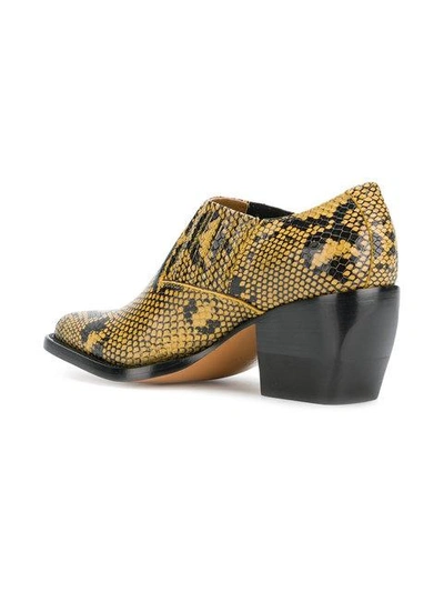 Shop Chloé Snake Printed Boots In Yellow