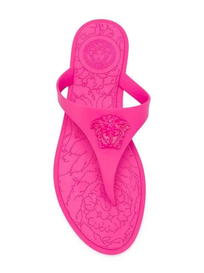 Shop Versace Medusa Head Flip Flops - Pink