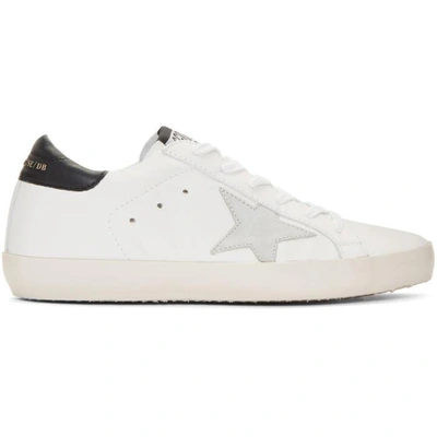 Shop Golden Goose White And Black Superstar Sneakers In White-black