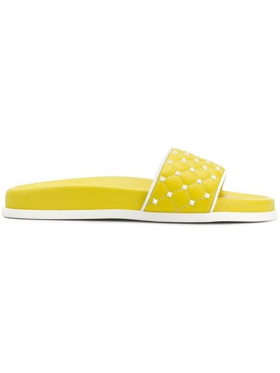 Shop Valentino Garavani Free Rockstud Spike Slides - Yellow