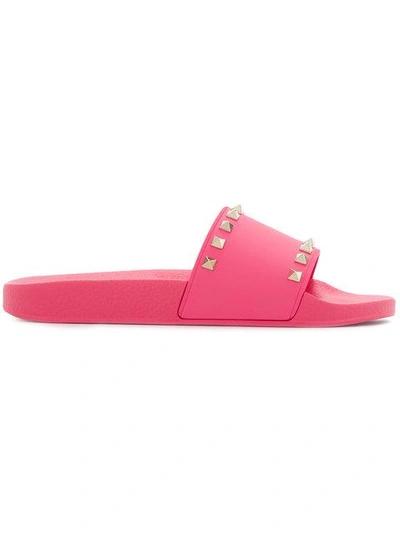 Shop Valentino Rockstud Slides In Pink