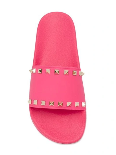 Shop Valentino Rockstud Slides In Pink