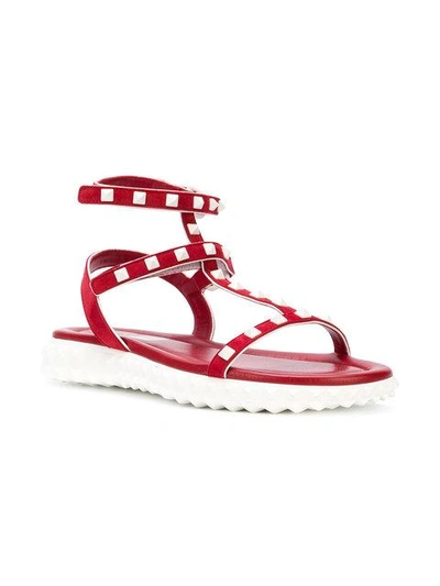 Shop Valentino Flat Rockstud Sandals - Red