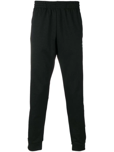 Shop Adidas Originals Tapered Track Pants In Black