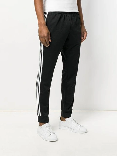 Shop Adidas Originals Tapered Track Pants In Black